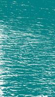 A vibrant surface depicting textured waves in shades of teal, showcasing dynamic movement and natural beauty. vector