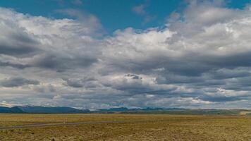 Time lapse of clouds moving over mountains and plain in Iceland video
