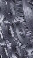 A close-up perspective showcases a series of rotating interlocking metal gears, highlighting the precise engineering and the complexity of mechanical design in machinery. vertical footage video