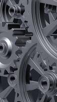 A close-up perspective showcases a series of rotating interlocking metal gears, highlighting the precise engineering and the complexity of mechanical design in machinery. vertical footage video