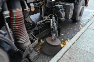 Working rotating brush of city cleaning machine photo