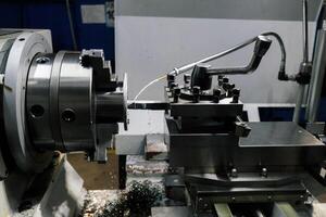Working lathe with liquid coolant, close up photo