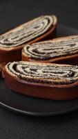Sweet homemade roll with poppy seeds on a dark concrete background video
