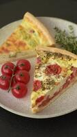 Delicious quiche with broccoli, cheese, chicken, spices and herbs on a dark concrete background video
