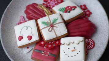 Sweet madeleine sponge cookies covered with colored chocolate in a Christmas style video