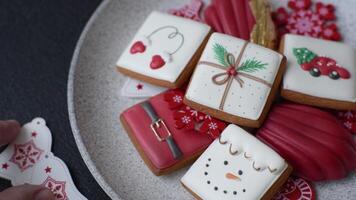 Sweet madeleine sponge cookies covered with colored chocolate in a Christmas style video