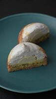 Sweet lemon tart with cream filling and zest on a dark concrete background video