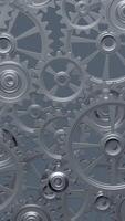 A close-up perspective showcases a series of rotating interlocking metal gears, highlighting the precise engineering and the complexity of mechanical design in machinery. vertical footage video