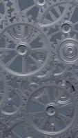 A close-up perspective showcases a series of rotating interlocking metal gears, highlighting the precise engineering and the complexity of mechanical design in machinery. vertical footage video