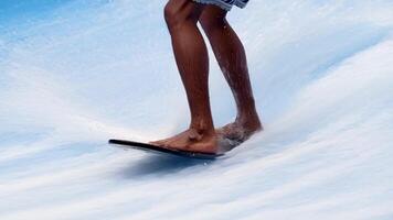 Close-up legs surfer balancing on surfboard. Water sports activity. Instructor demonstrating how to stand up on surfboard. The concept of practice and perseverance before it succeeds. Free copy space video