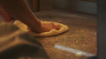 A person is putting a pizza on a counter video
