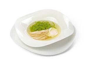 Chicken soup with noodles isolated on white photo