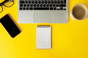 Open laptop with blank notebook, view from above. Workplace concept photo