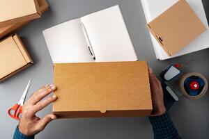 Above table top view of warehouse preparing post courier delivery package photo