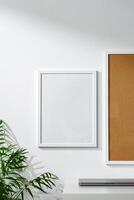 Cork board and blank frame hanging on the wall photo