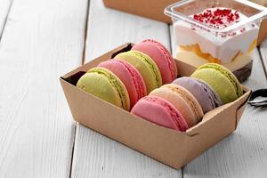 Colorful macaron cookies in a cardboard box photo