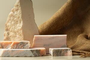 Granite stone podium decorated with sackcloth on beige background photo