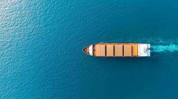 Cargo ship navigates calm waters under bright blue sky during daytime in expansive ocean photo
