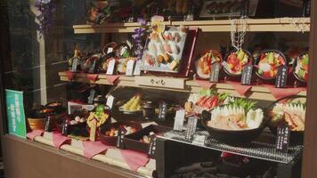 Transparent display windows filled with food replicas in Japan on June 16, 2024. video