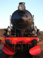 Fromt view of a historic locomotive in Kusfors in Sweden photo