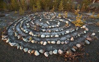 Meditative rock maze in the evening sun photo