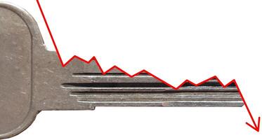 Side view of a key symbolizing a decline or negative trend photo