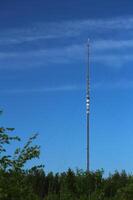 Transmitter tower in Sweden in front of blue sky photo