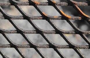 Close up of a slightly rusty cooking grate photo