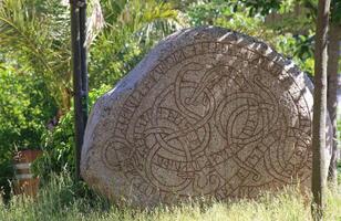 Historic rune stone at the castle in Trelleborg, Sweden photo