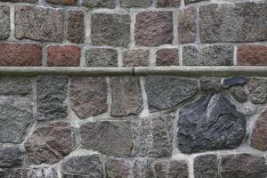 Stone wall with an horizontal edge and two styles photo