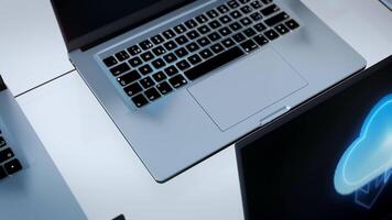 Several laptops with a cloud on them video