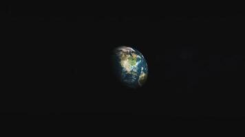 The earth is seen from space in a black background video