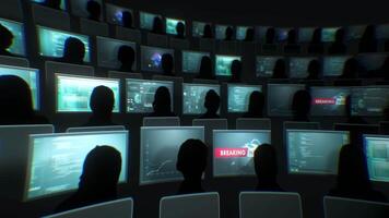 A group of people are sitting in front of a large screen video