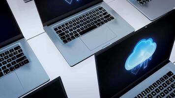 Several laptops with cloud computing icons on them video