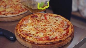 Process of making pizza. Close up of fresh original pizza preparation video