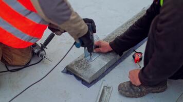 Electrician installing solar panel. Solar panel technician with drill installing solar panels frame video