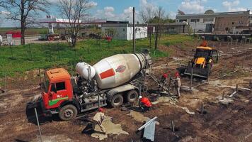 Machinery working on construction. Aerial view over new constructions site video