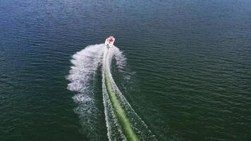 Aerial view of boat on river. Drone view of motor boat sailing on river video