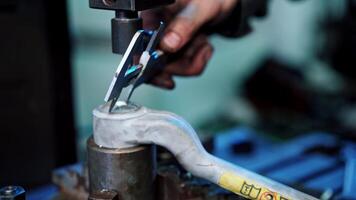 Worker using vernier calipers. Industrial worker measuring detail with vernier caliper in factory workshop video