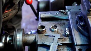 Metallic lathe working at factory. Operator machining part by cnc turning machine video