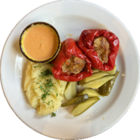 Craving a home-cooked meal... Try these stuffed peppers filled with savory beef and served with creamy mashed potatoes. png