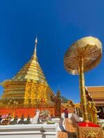 Many people come to pray at the Doi Suthep Temple, The temple founded in 1385 is a major landmark tourist attraction photo