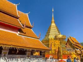 Many people come to pray at the Doi Suthep Temple, The temple founded in 1385 is a major landmark tourist attraction photo