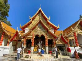 Many people come to pray at the Doi Suthep Temple, The temple founded in 1385 is a major landmark tourist attraction photo