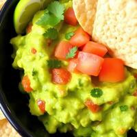 Guacamole with Tomatoes Cilantro and Tortilla Chips photo