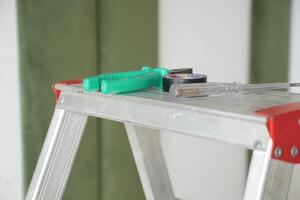 Vital Tools on a Ladder Getting Ready for Home Improvement Projects photo