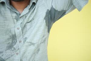 A detailed view of a man with sweat marks showcasing the impact of intense humidity photo