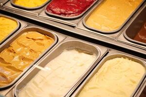 chocolate, vanila and orange favor of ice cream display for sale photo