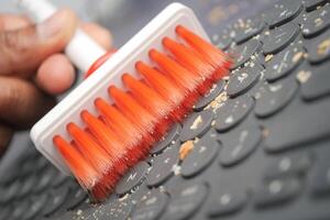 Cleaning Your Keyboard with a Brush An Effective Method for Dust Removal photo