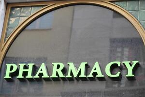 visible pharmacy sign on a building photo